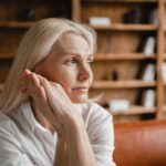 Blonde woman sitting on a couch